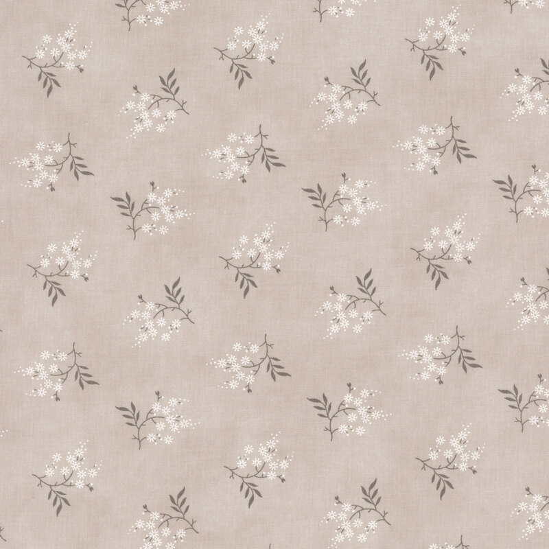 tonal light gray fabric featuring scattered white flowers