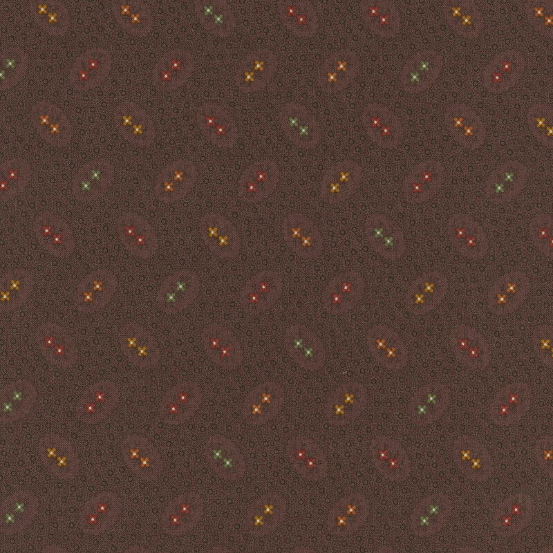 Brown fabric featuring orange, green, red, maroon, and yellow flowers surrounded by dot texturing