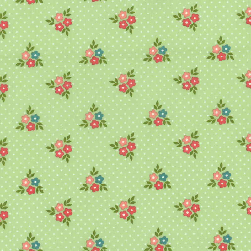 fabric featuring clusters of pink, dark pink and teal flowers with cream white polka dots on a fresh minty green background.