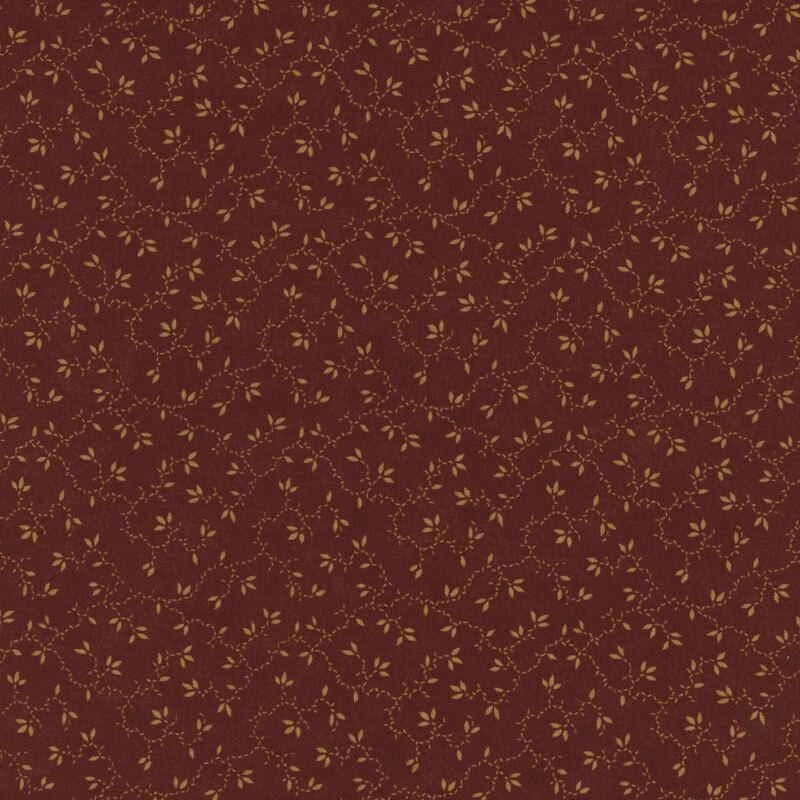 brick red mottled fabric featuring butterscotch vines and leaves