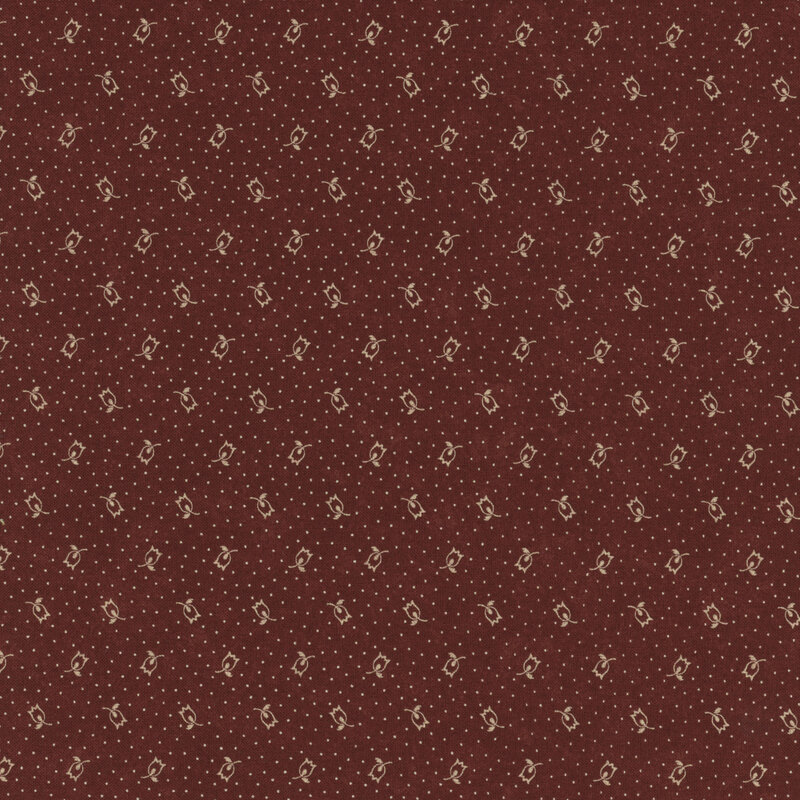 brick red fabric featuring scattered tan dots and flowers