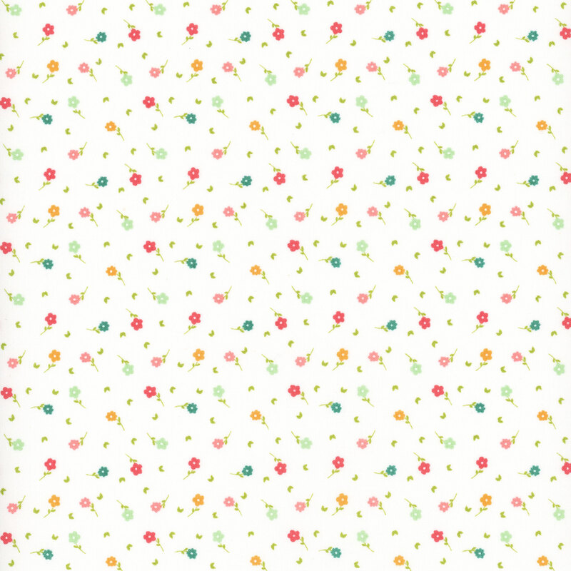 fabric featuring multicolored ditsy flowers on a solid white cream background.