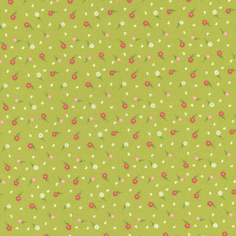 fabric featuring light pink, dark pink, and cream ditsy flowers on a solid bright green background.