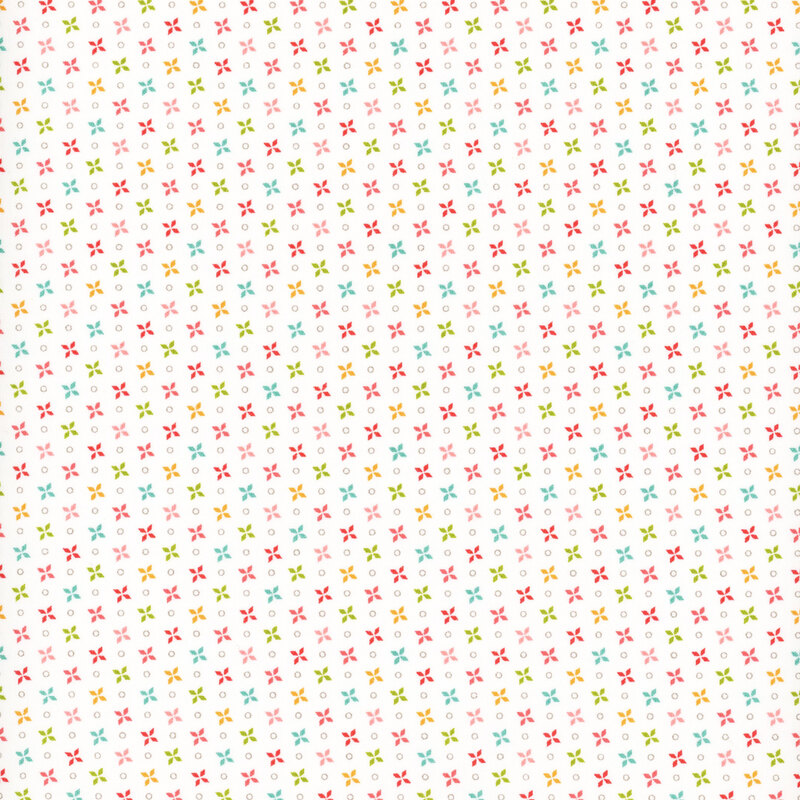 fabric featuring multicolor pinwheel print on a solid cream white background.