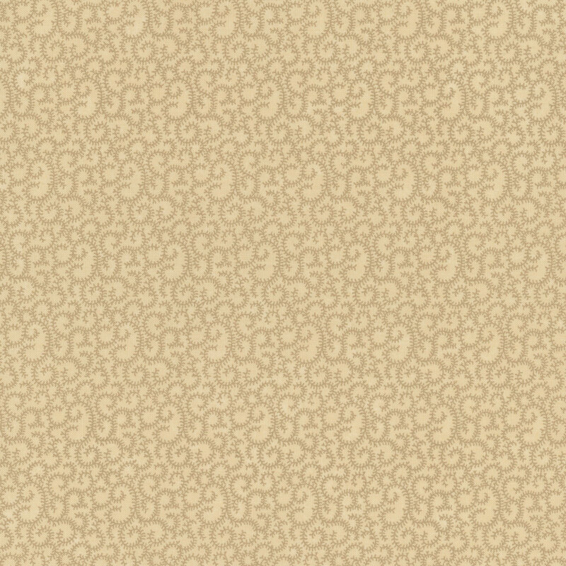beige fabric featuring swirling tan vines