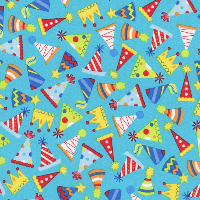 aqua fabric featuring various scattered brightly colored party hats and crowns