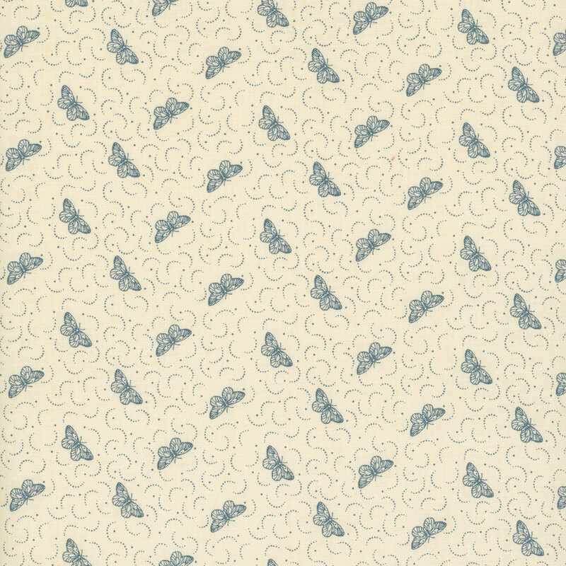 fabric featuring tossed faded blue butterflies with dots and dotted crescents on a solid cream background.