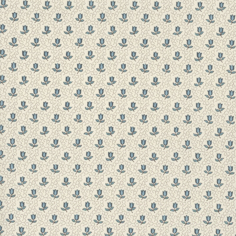 fabric featuring blue roses on a solid cream background with delicate swirling dots.