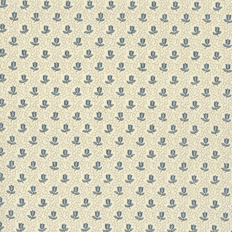 fabric featuring blue roses on a solid cream background with delicate swirling dots.