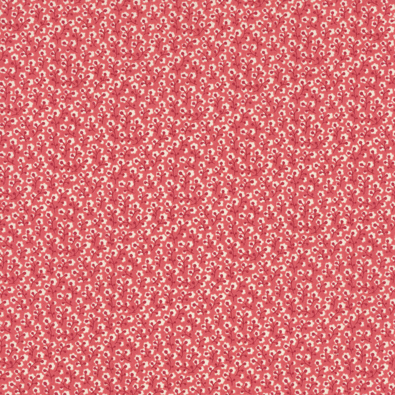 fabric featuring cream and dark red flower vines on a faded brick red background.