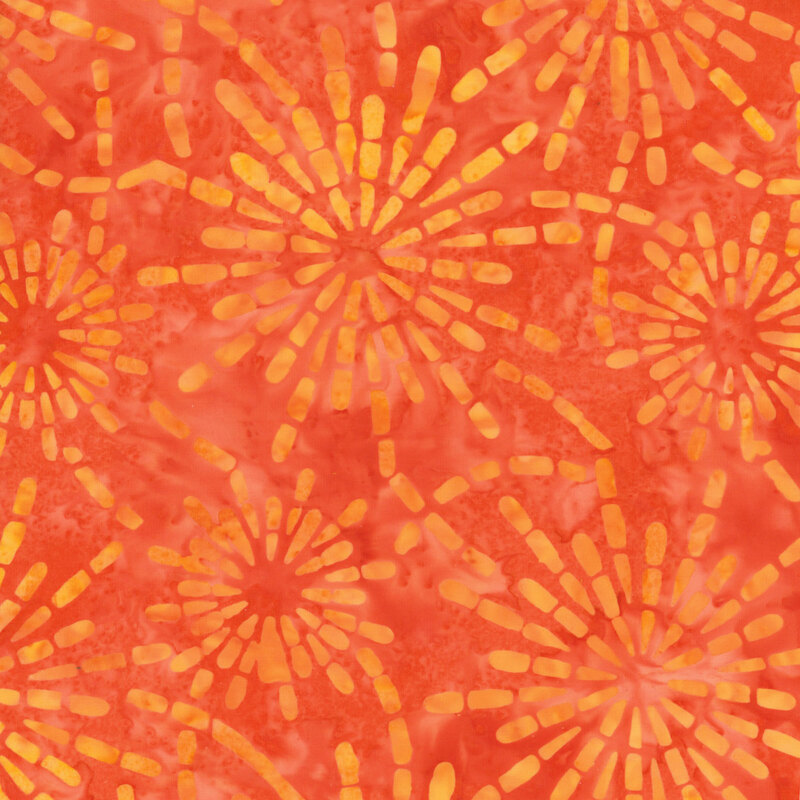 vibrant mottled orange fabric featuring golden yellow and orange starburst patterns
