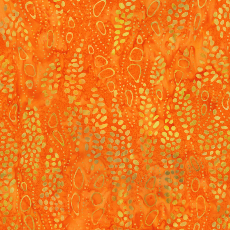 vibrant orange fabric featuring an amorphous yellow and orange dot pattern