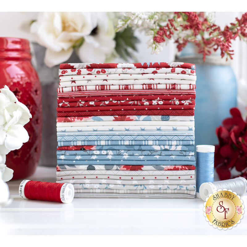 fat quarter stack of Old Glory by Moda Fabrics surrounded by flowers and jars