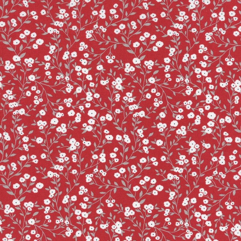 fabric featuring gray spreading vines with crisp white flowers on a bold red background.