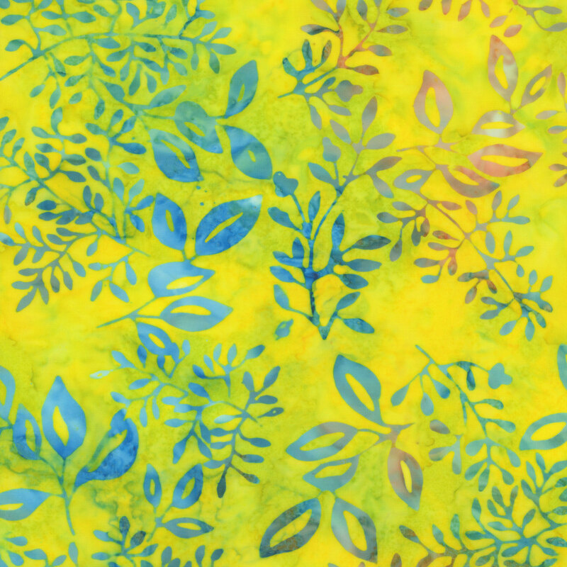 bright yellow-green mottled fabric featuring brilliant blue and orange mottled leaves scattered across it