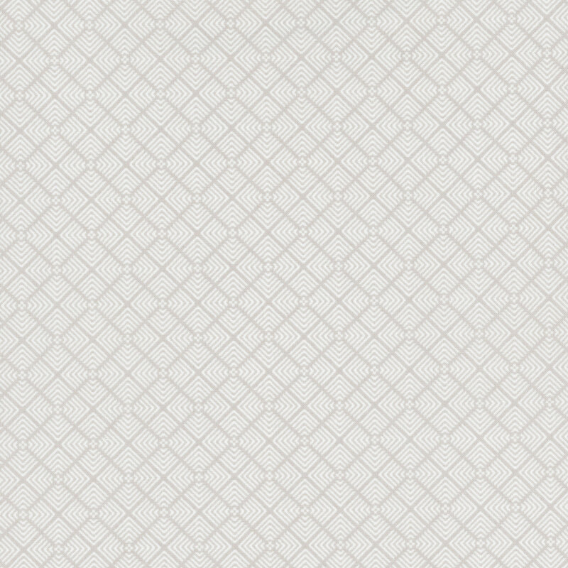 fabric featuring white geometric angles repeating in a tiled pattern on a gray background.