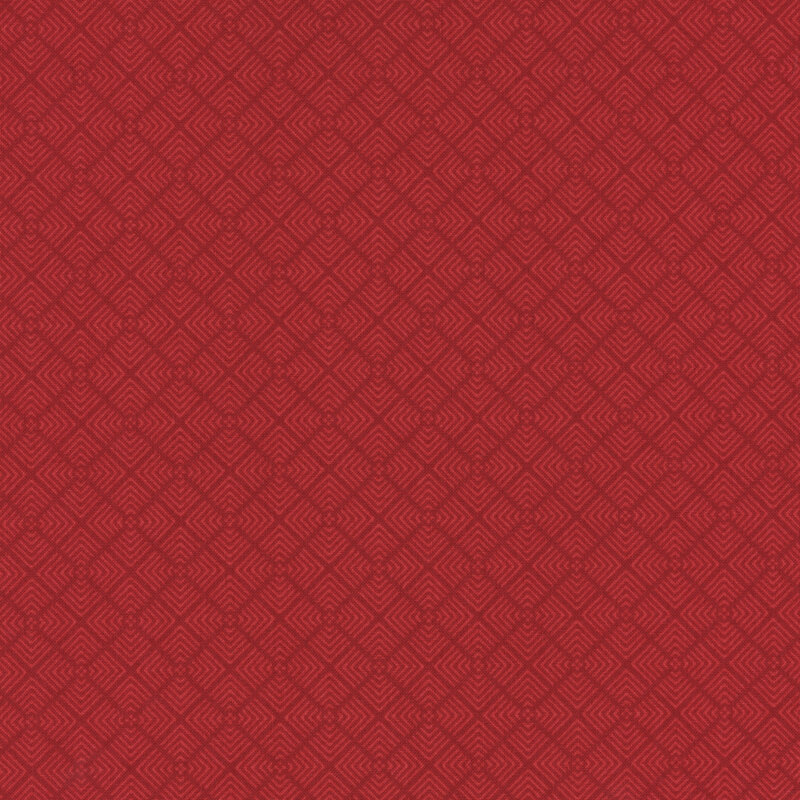 fabric featuring bold red geometric angles repeating in a tiled pattern on a dark red background.
