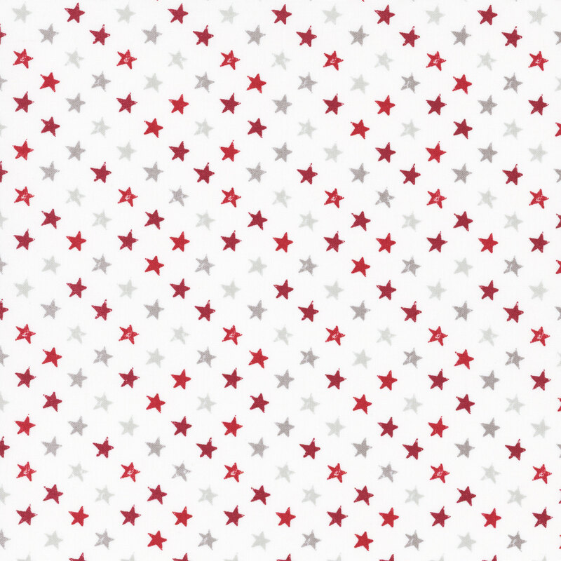 fabric featuring red and tonal gray stars on a solid white background.