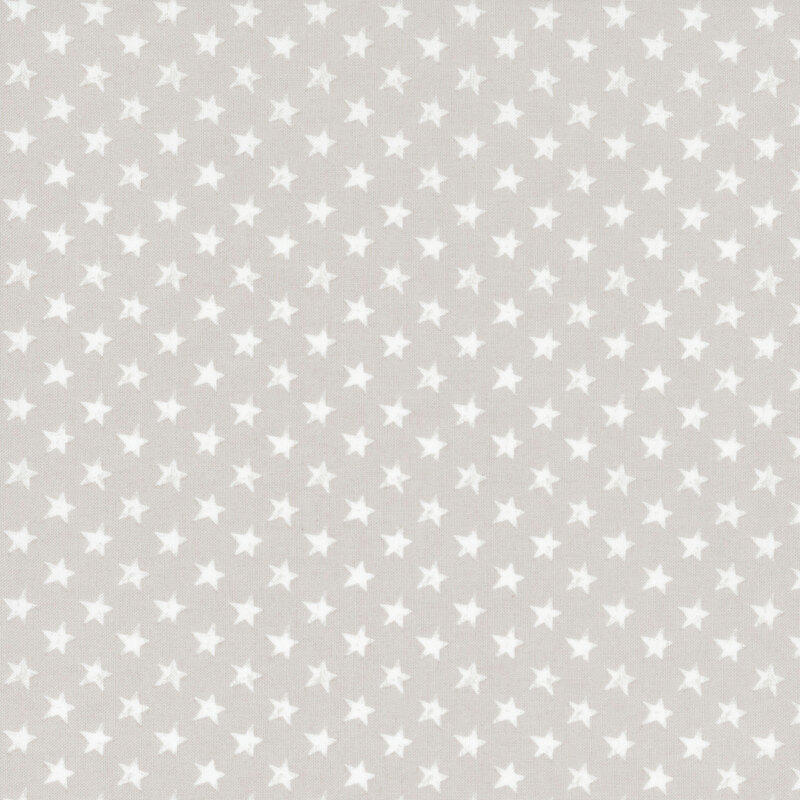 fabric featuring grunge white stars on a solid gray background.