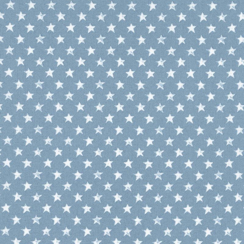 fabric featuring grunge white stars on a solid blue sky background.