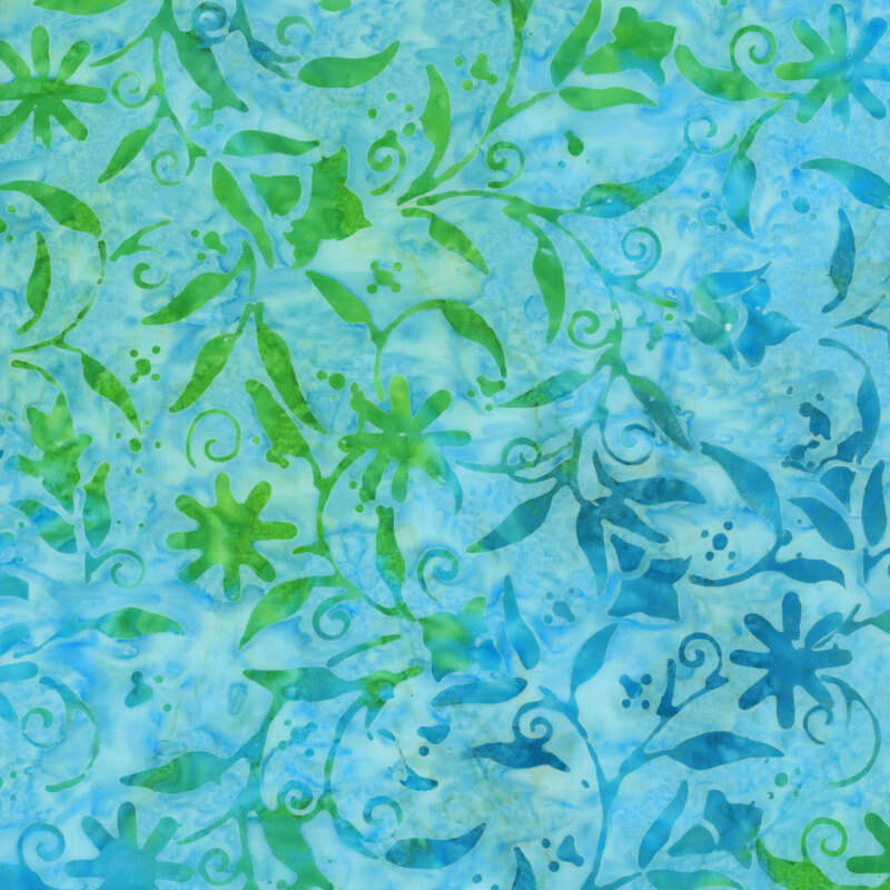 vibrant light blue batik fabric featuring a mottled green and aqua floral swirling pattern