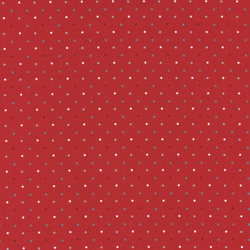 fabric featuring red white and blue polka dots on a solid bright red background.