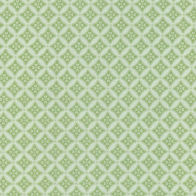 Green tonal fabric in a geometric, mosaic-like pattern