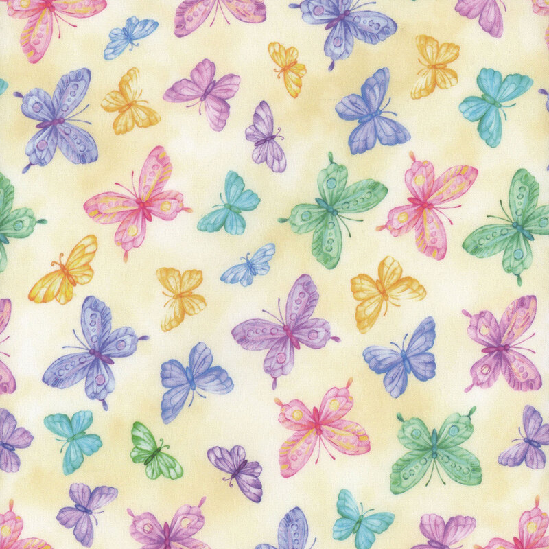 yellow mottled fabric with different sized rainbow butterflies all over