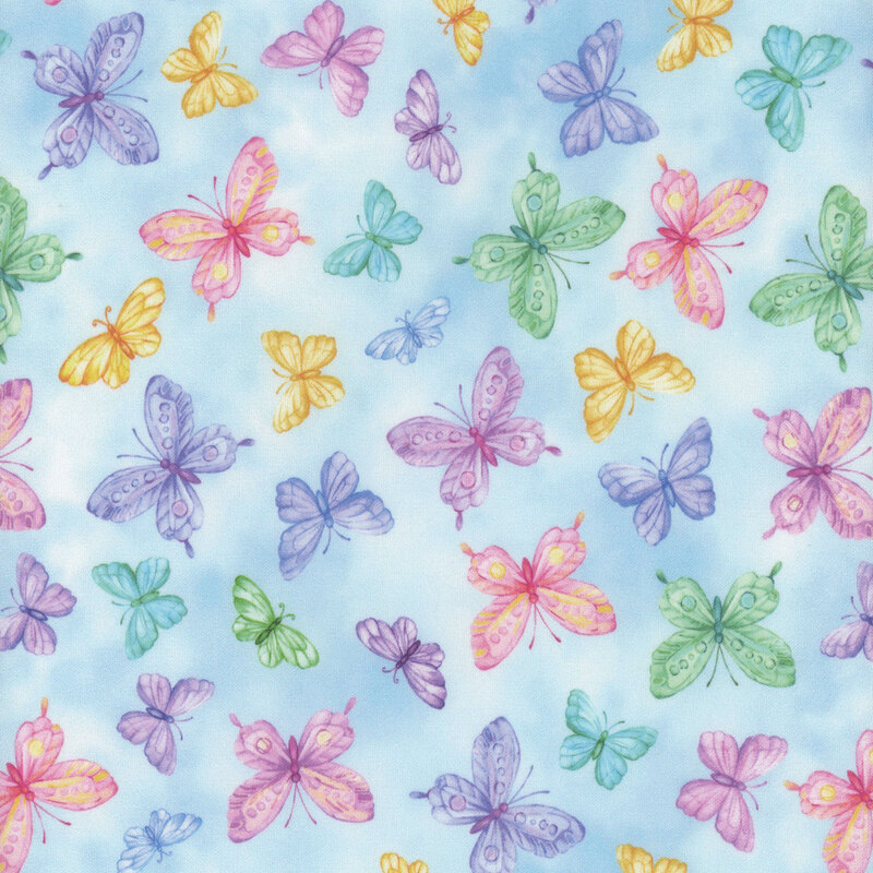 blue mottled fabric with different sized rainbow butterflies all over
