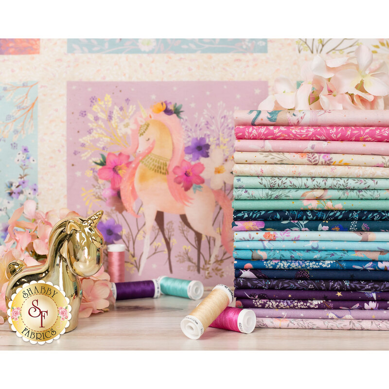 pink, cream, teal, blue, and purple unicorn themed fabrics stacked in front of the Unicorn Meadow panel