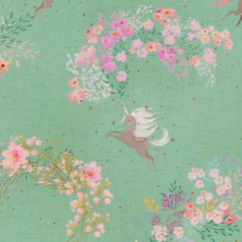 seafoam green fabric featuring various unicorns with a trail of warm colored flowers from the horn with scattered stars
