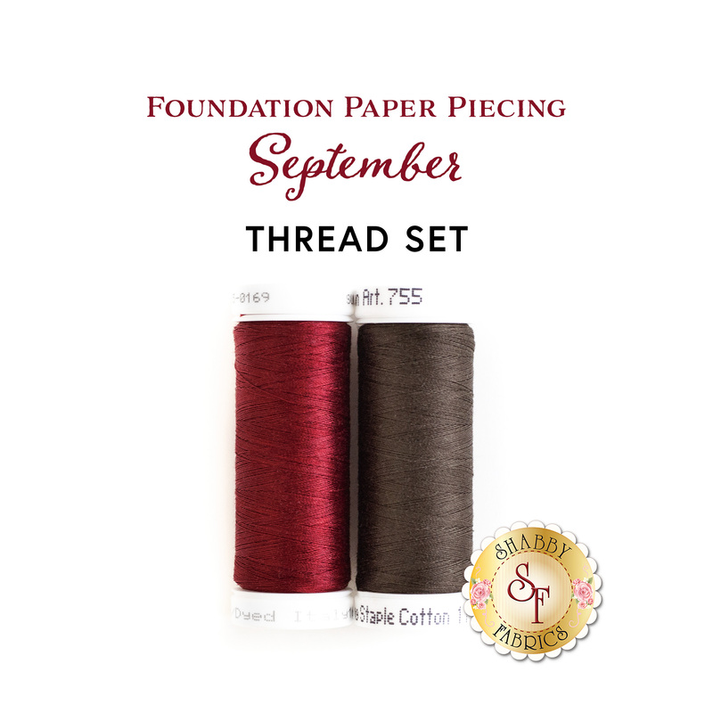Two thread spools, one red and one brown, isolated on a white background with the words 