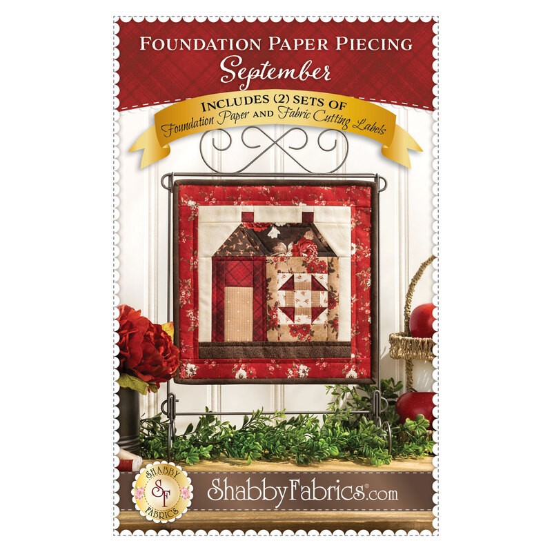 Front cover of Foundation Paper Piecing September pattern, with a mini quilt on a curled wire tabletop display hanger
