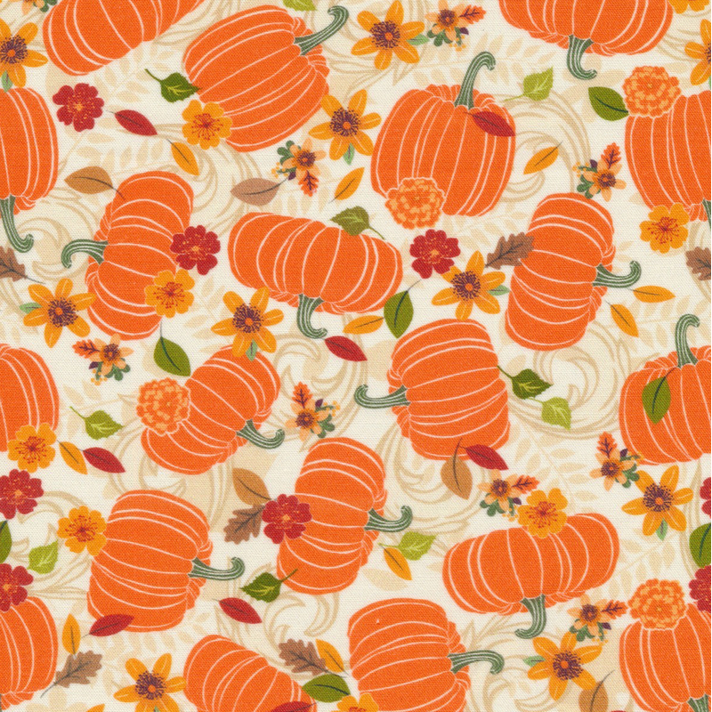 whimsical cream fabric featuring scattered pumpkins, leaves, and flowers over cream tonal scrolling and leaves
