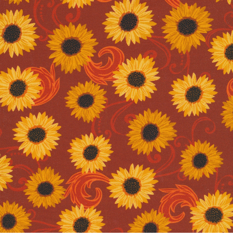 deep red fabric featuring red scrolling and scattered sunflowers