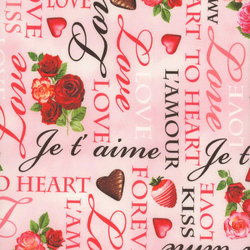 pale pink fabric featuring various love themed words and phrases with roses, chocolates, and chocolate covered strawberries