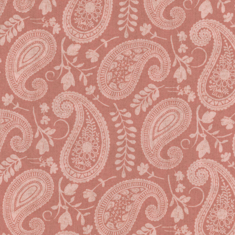 red fabric featuring a pink tonal paisley, with pink flowers and leaves intermixed