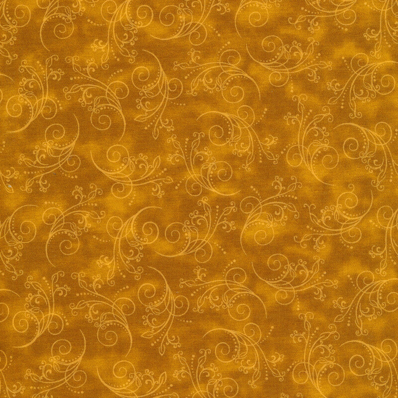 gorgeous deep ochre fabric featuring tonal mottling and scattered pastel scrolling