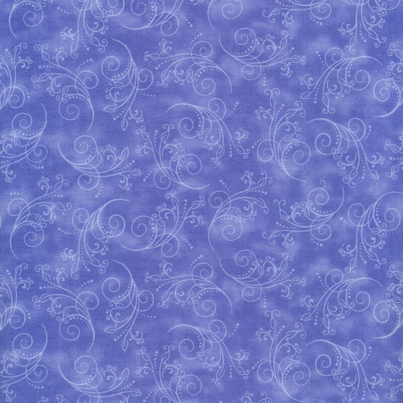 gorgeous cornflower blue fabric featuring tonal mottling and scattered pastel scrolling
