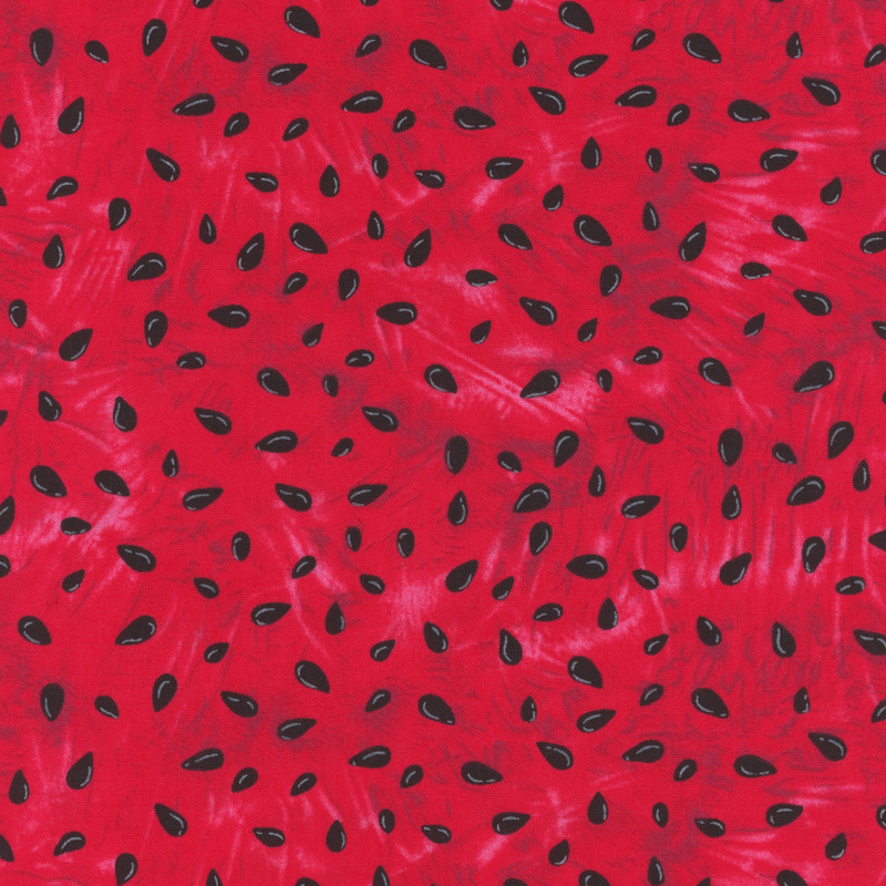 Red mottled fabric made to look like the red flesh of a watermelon with black seeds