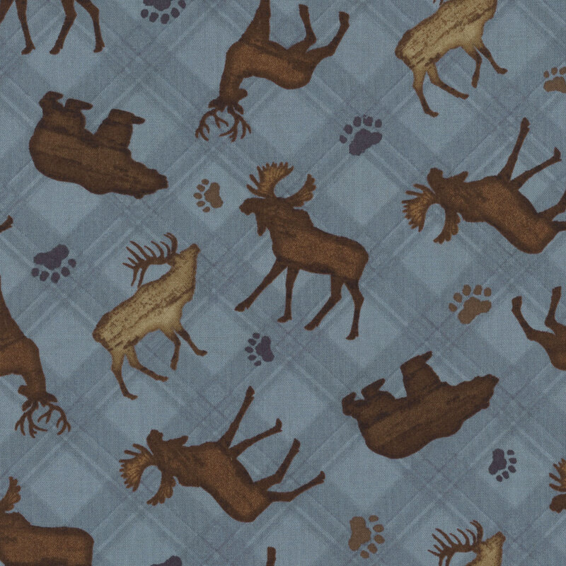 Blue fabric featuring scattered moose, elk, deer, and bears with paw prints on a plaid background.