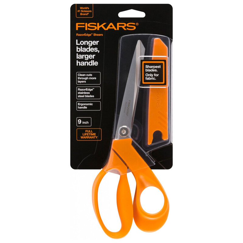 fiskars orange handled scissors in a black package