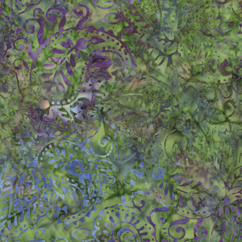 lovely green batik fabric featuring paisley patterning with purple and blue mottling throughout
