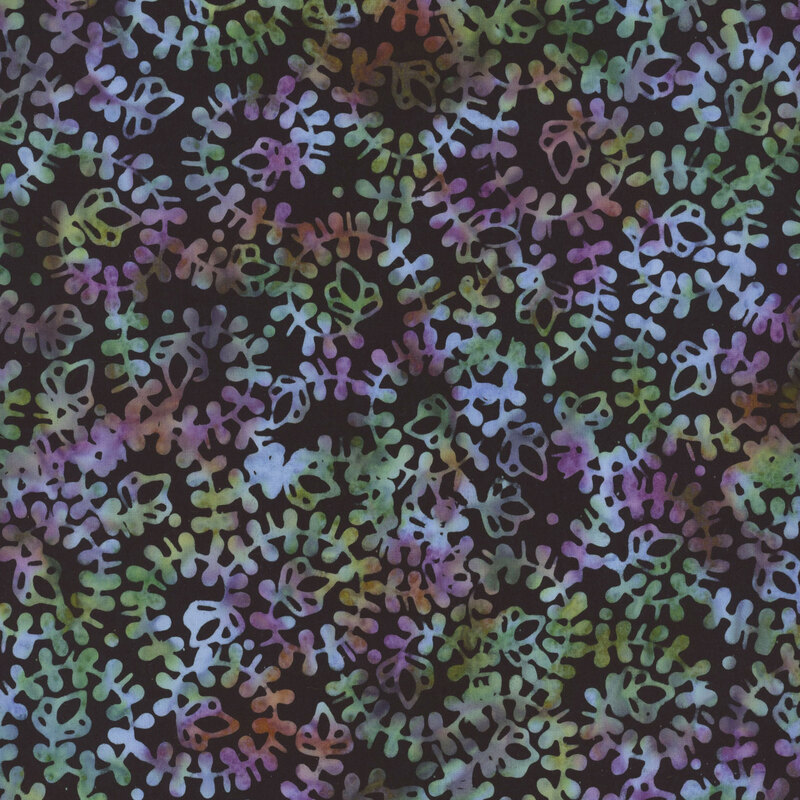 black batik fabric featuring a swirling vine pattern in mottled shades of blue, purple, and green