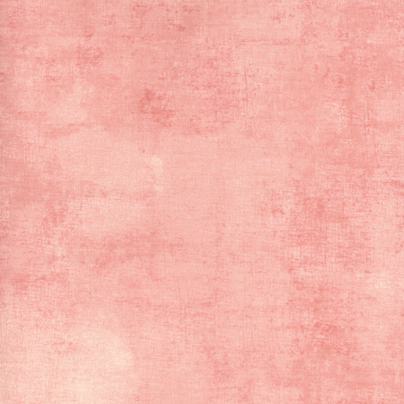 fabric with a beautiful peach pink dry brush texture on a pastel pink background