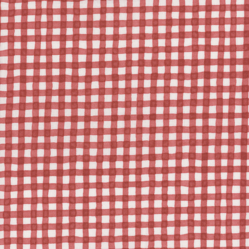 watercolor styled gingham fabric featuring cream and red coloring