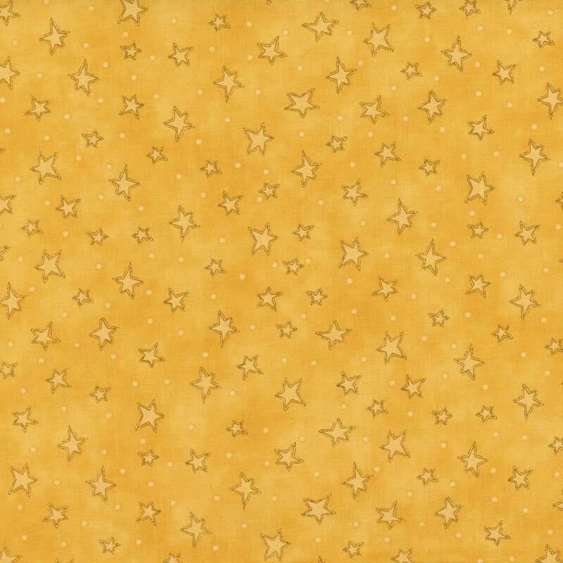 mottled gold fabric with scattered ditsy stars and tonal speckles