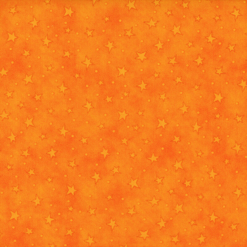 mottled orange fabric with scattered ditsy stars and tonal speckles