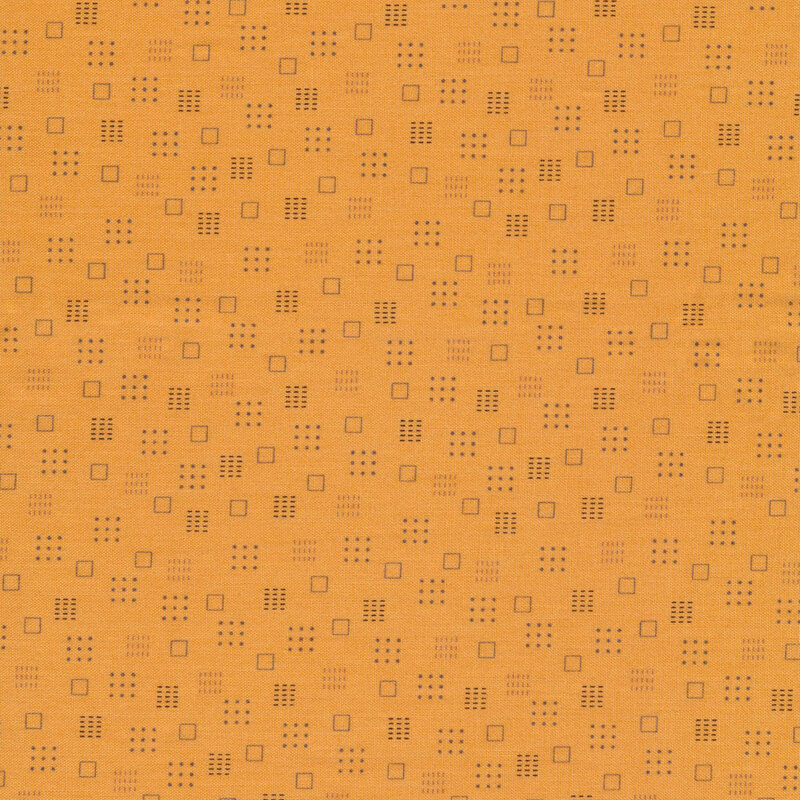 orange fabric featuring scattered square shapes in various shades of brown