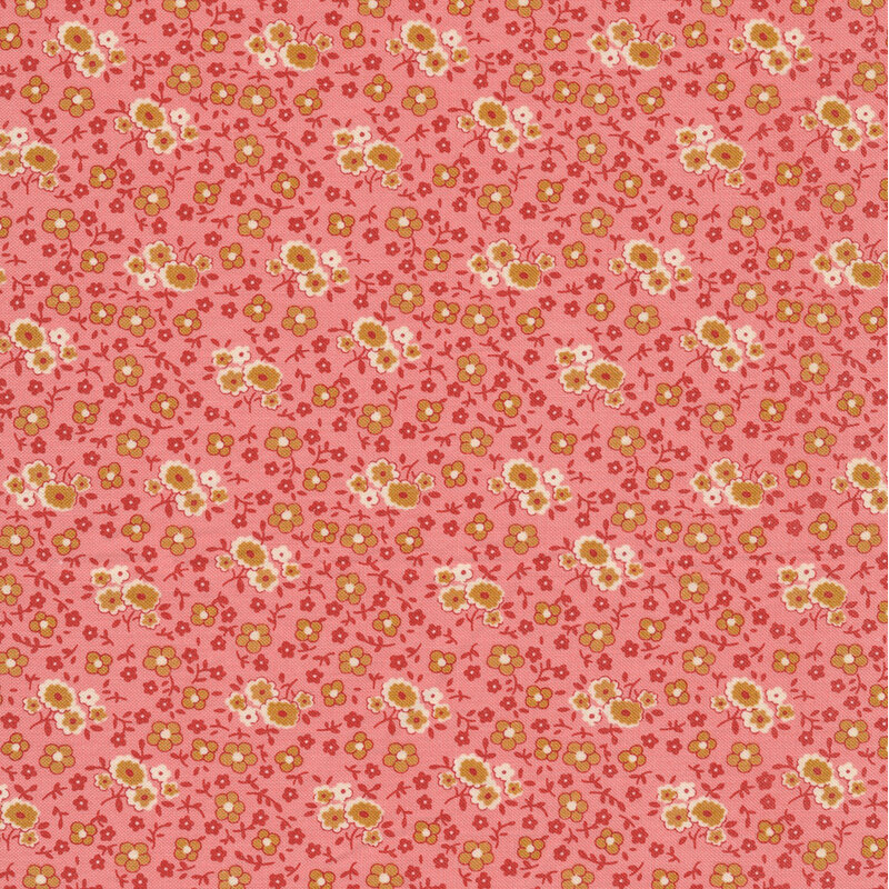 bubblegum pink fabric featuring a packed floral design, in muted shades of red, orange, tan, and white